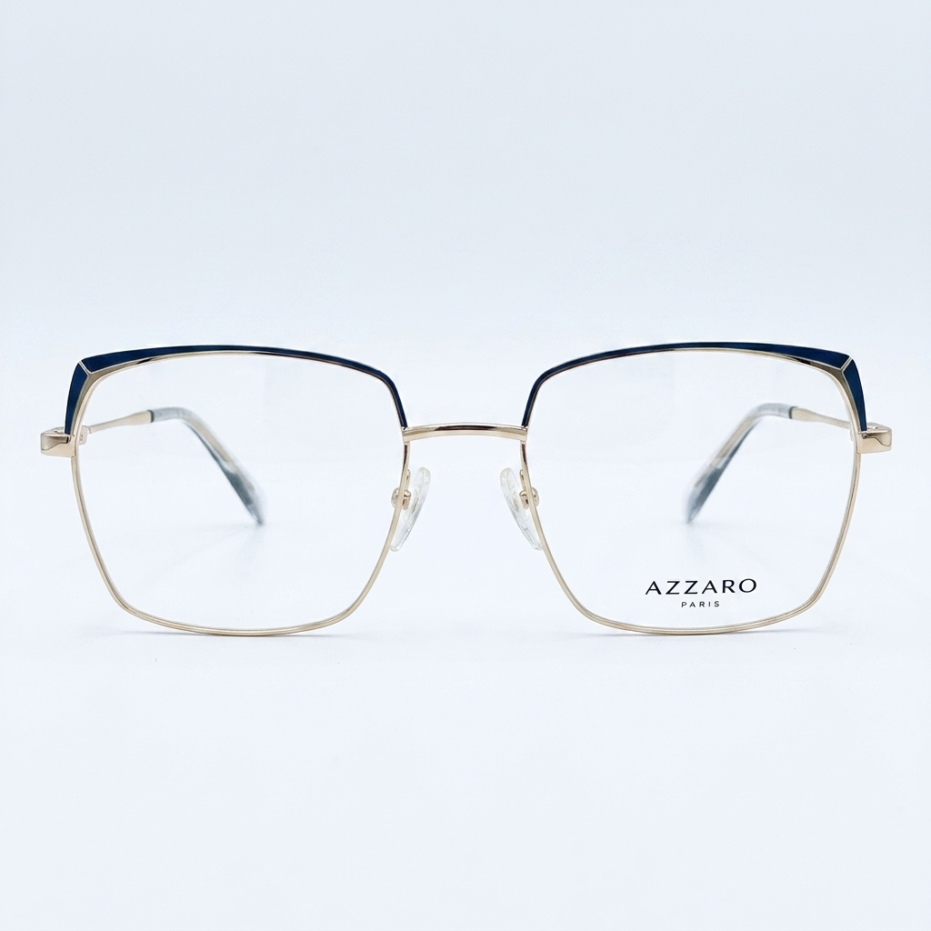 Pair of gold metal eyeglasses with a dark blue top edge on a white background, showcasing the frame design.